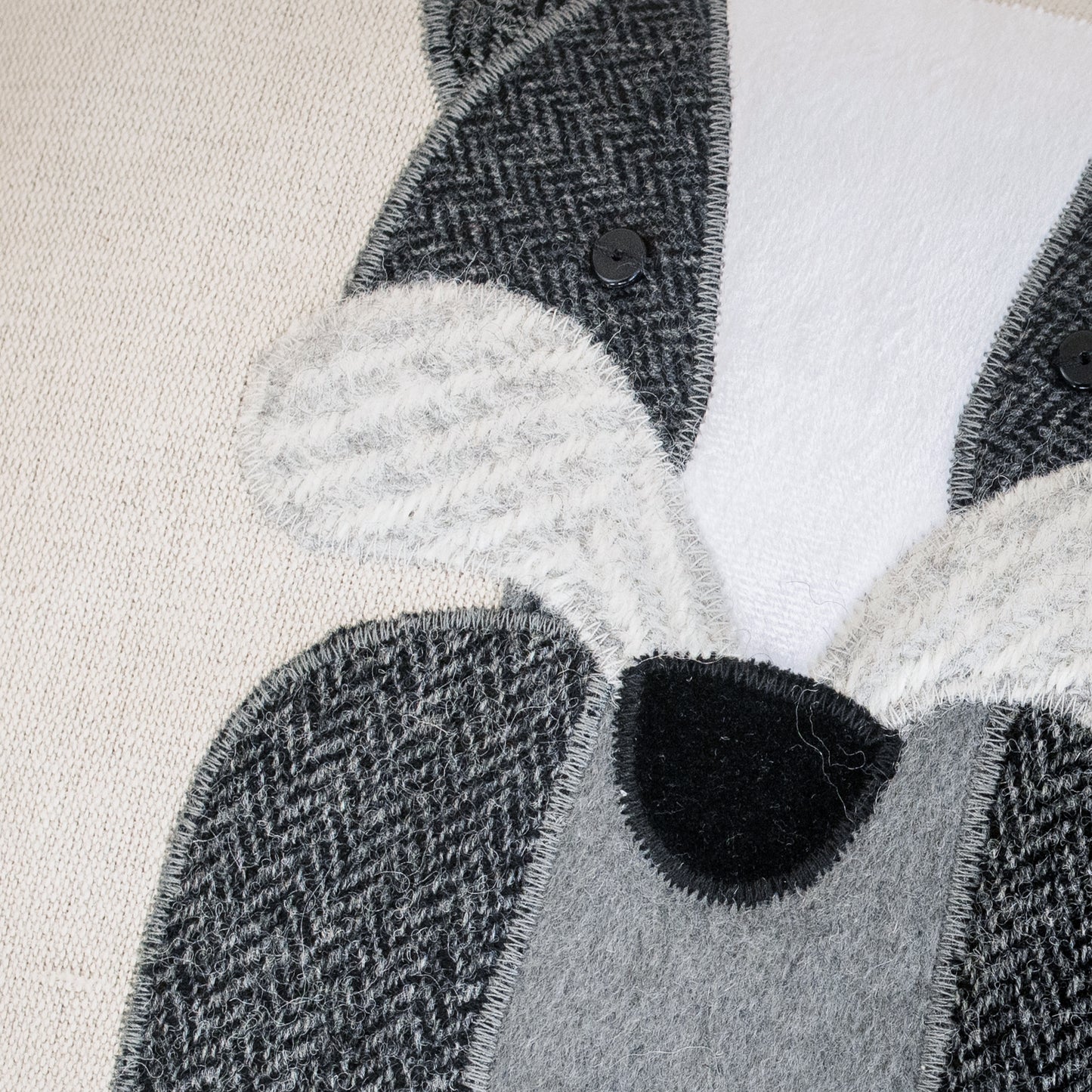 Close up of handmade badger cushion