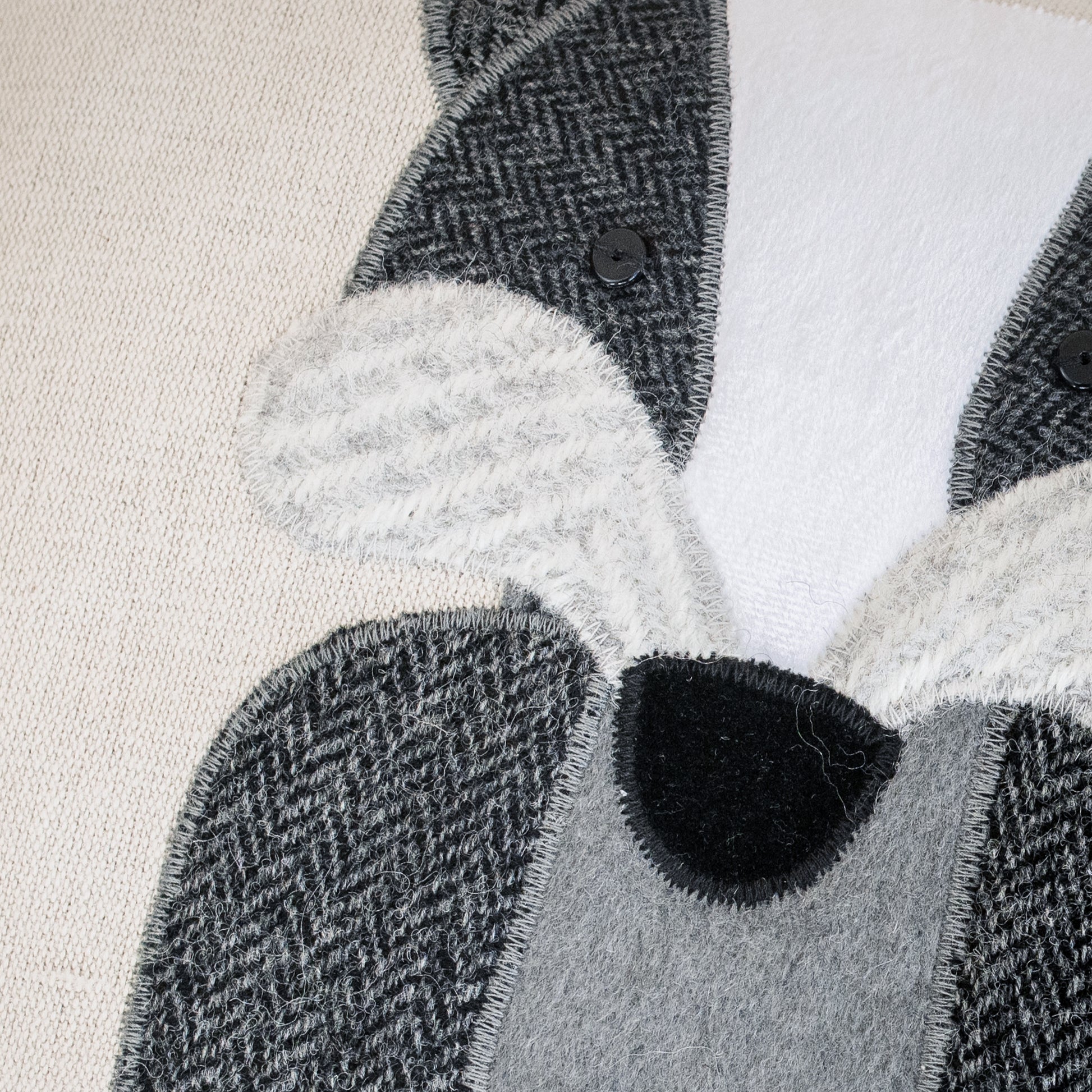 Close up of handmade badger cushion