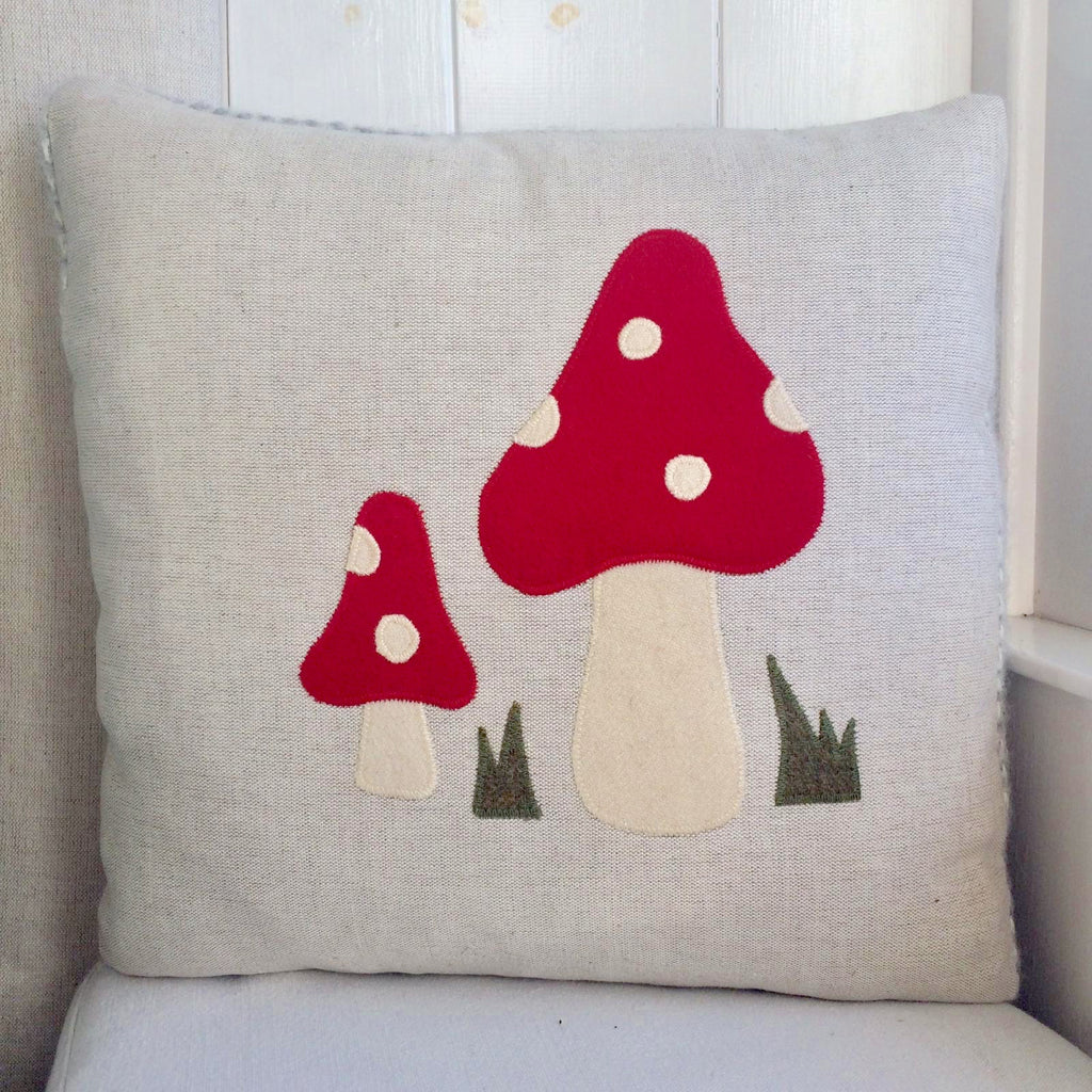 Handmade red toadstool cushion.